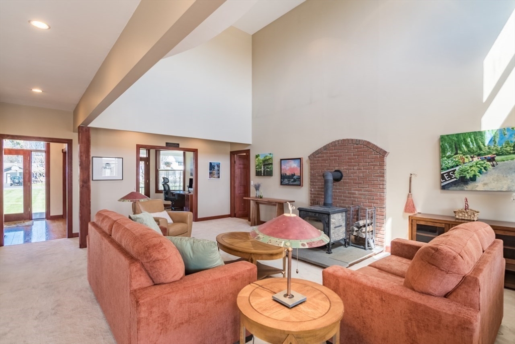 65 Bridge Street Hatfield, MA 01038 - Photo 7 of 40 a living room with furniture and a wooden floor