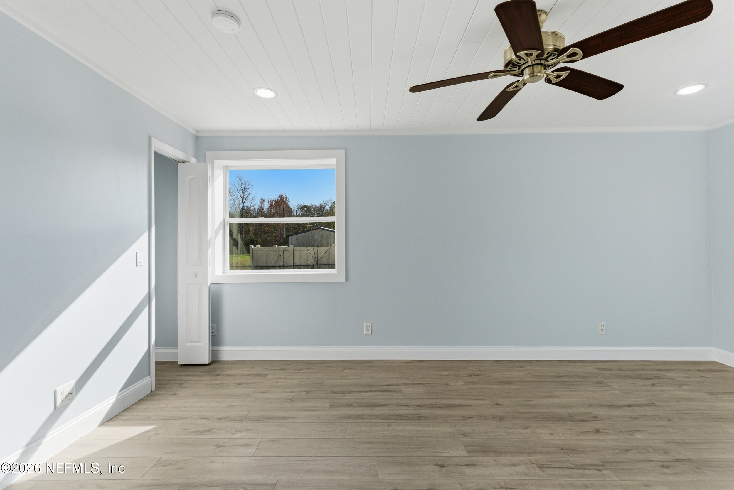 97150 Caravel Trail Yulee, FL 32097 - Photo 15 of 35 a view of a livingroom with a ceiling fan and hardwood floor
