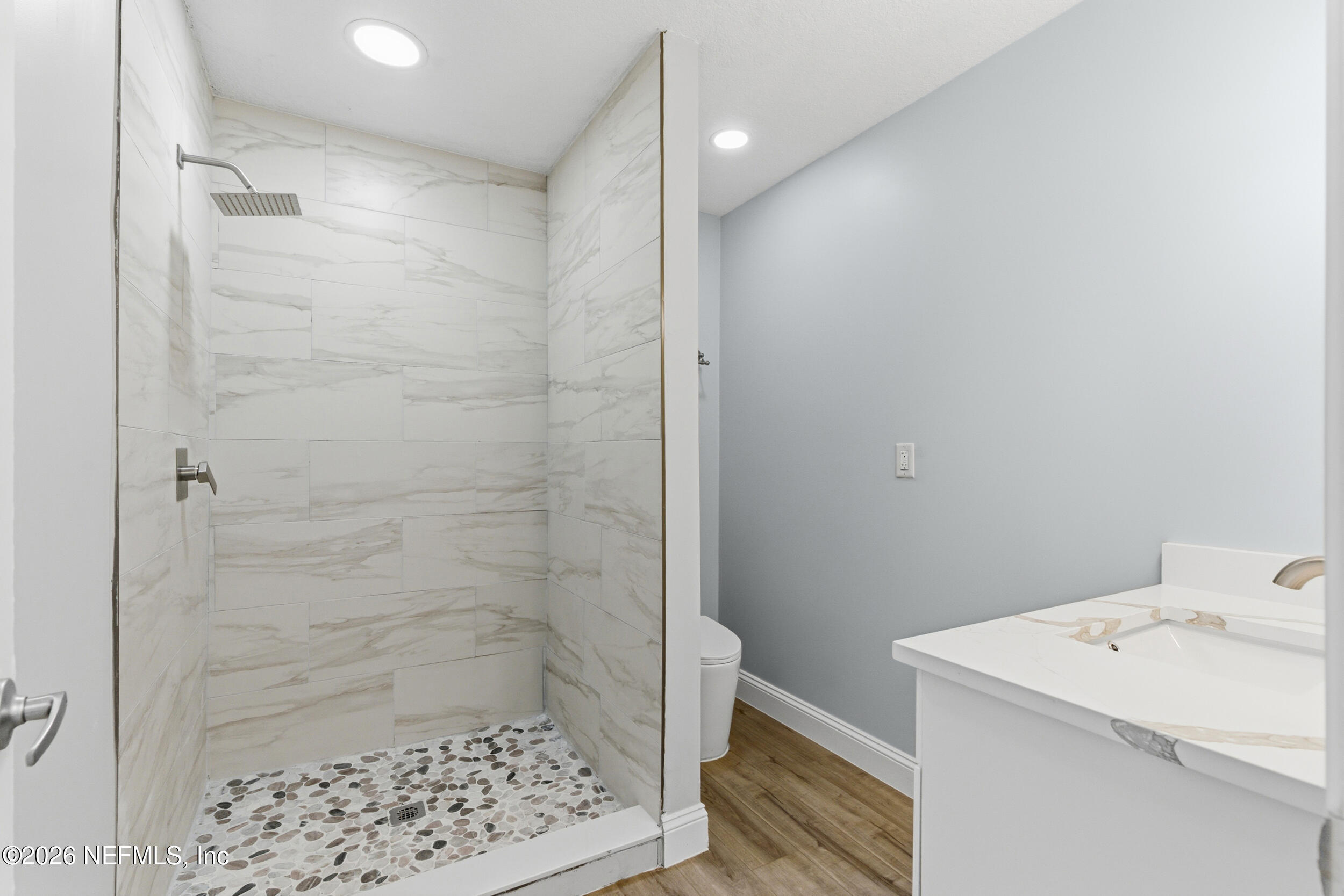 97150 Caravel Trail Yulee, FL 32097 - Photo 20 of 35 a bathroom with a sink a toilet and shower