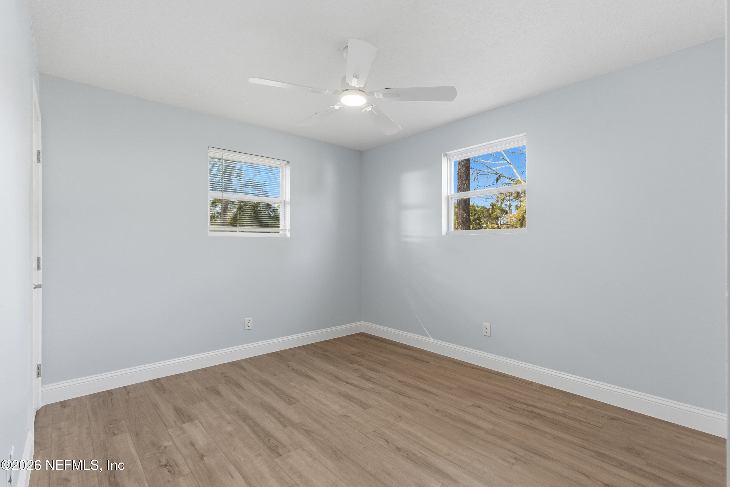 97150 Caravel Trail Yulee, FL 32097 - Photo 28 of 35 a view of an empty room with wooden floor