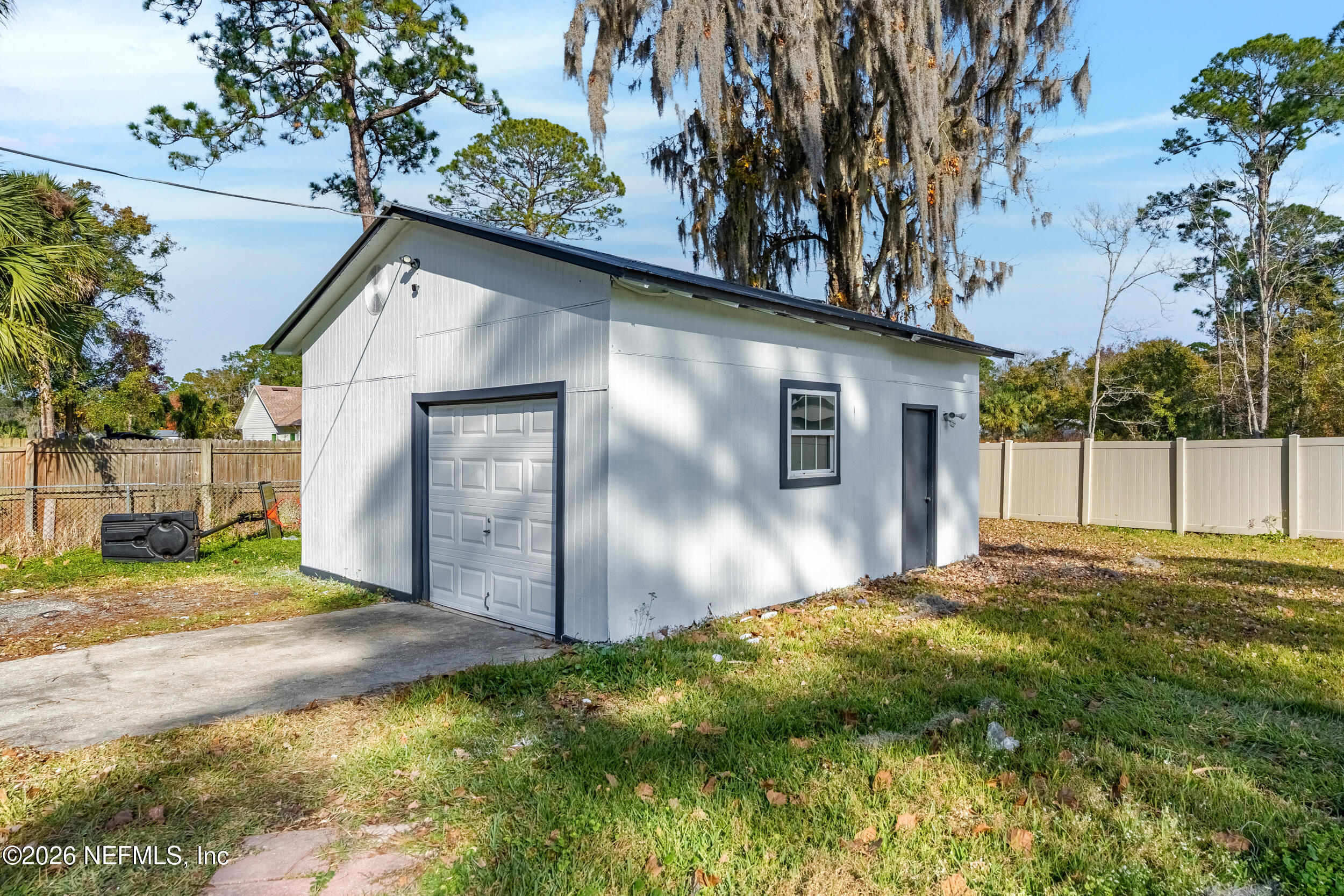 97150 Caravel Trail Yulee, FL 32097 - Photo 30 of 35 a backyard of a house with lots of green space