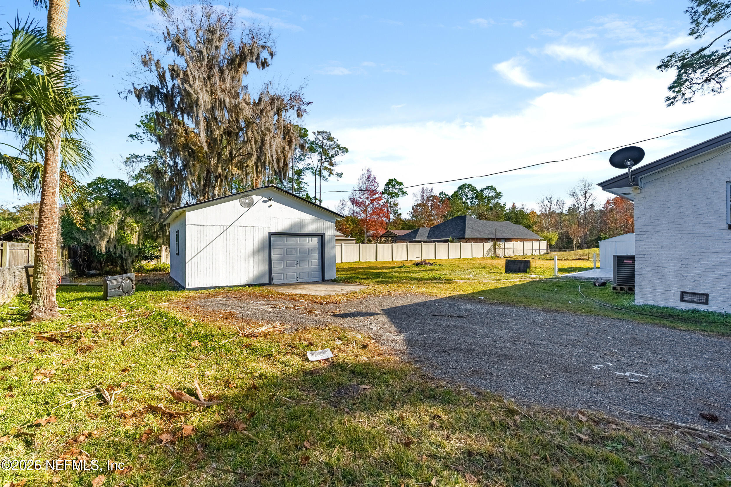 97150 Caravel Trail Yulee, FL 32097 - Photo 35 of 35 a view of a house with backyard and a tree