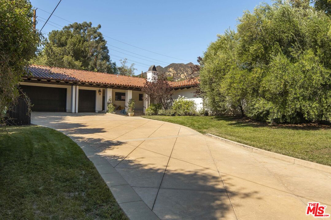 2251 Cold Canyon Road Calabasas, CA 91302 - Photo 45 of 47 a view of a house with a yard