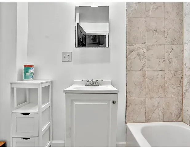 a bathroom with a sink and a bathtub