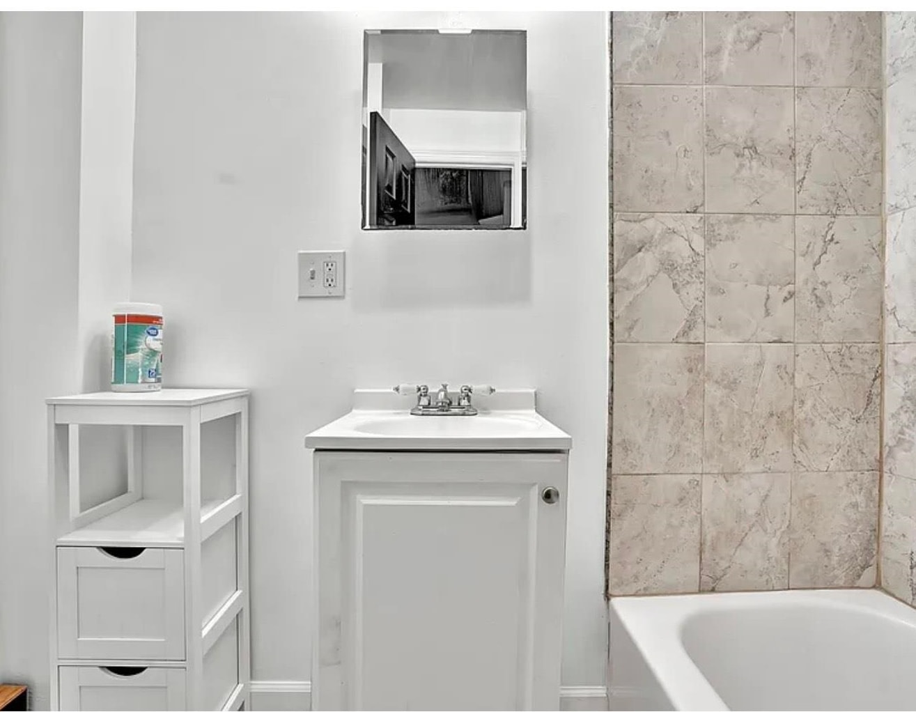 49 Tichenor Terrace, Unit 2 Irvington, NJ 07111 - Photo 4 of 9 a bathroom with a sink and a bathtub