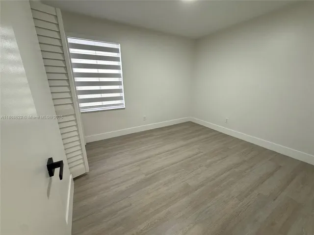 a view of a room that has a window in it