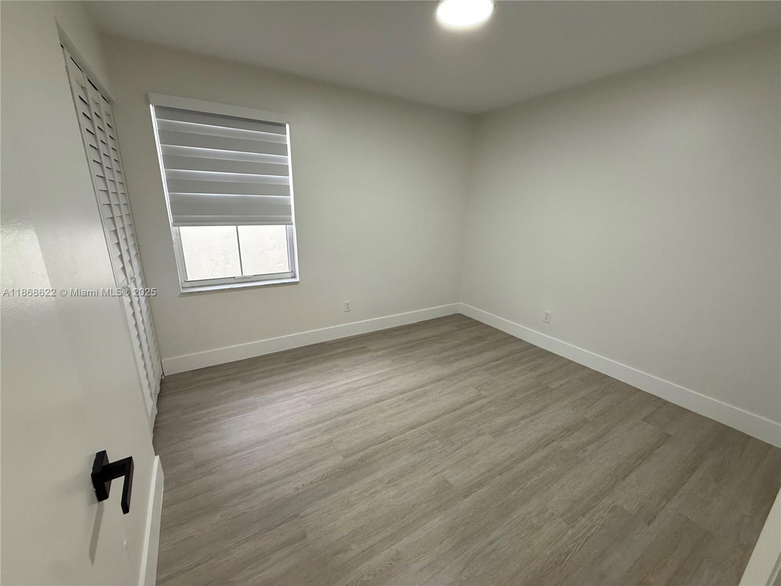 6955 Southwest 148 Lane Davie, FL 33331 - Photo 17 of 22 wooden floor in an empty room