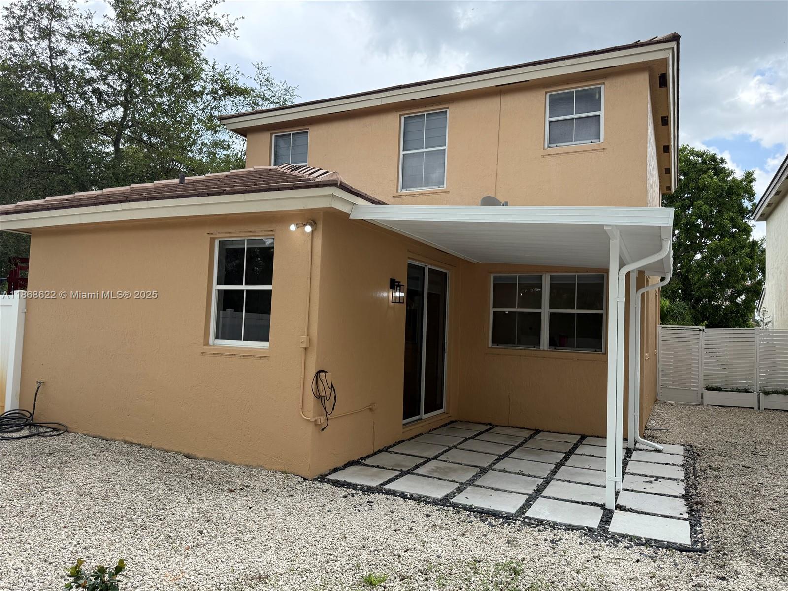 6955 Southwest 148 Lane Davie, FL 33331 - Photo 22 of 22 a view of a house with a backyard