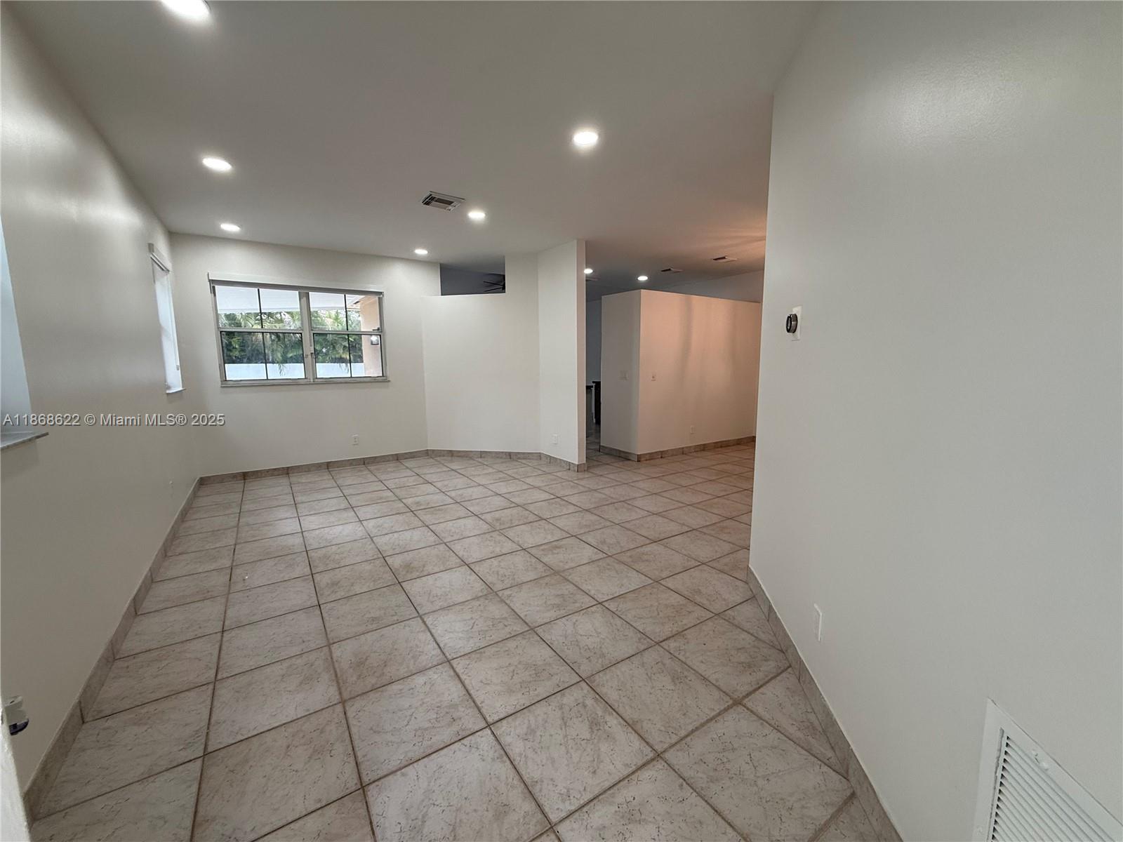 6955 Southwest 148 Lane Davie, FL 33331 - Photo 3 of 22 an empty room with windows