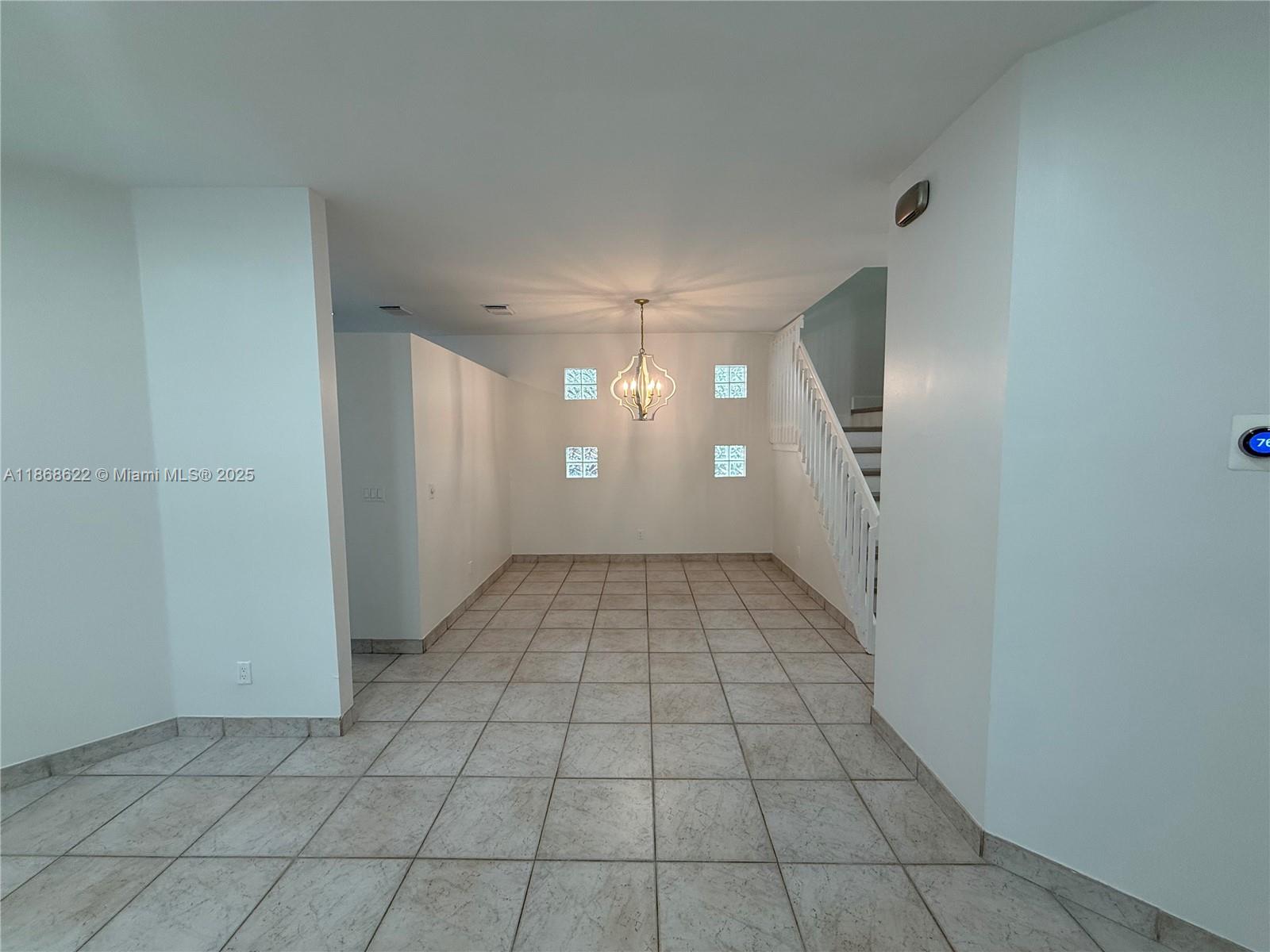 6955 Southwest 148 Lane Davie, FL 33331 - Photo 4 of 22 a view of an empty room and window