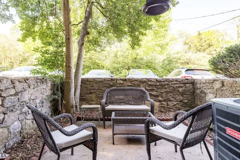 a view of a patio with couple of chairs