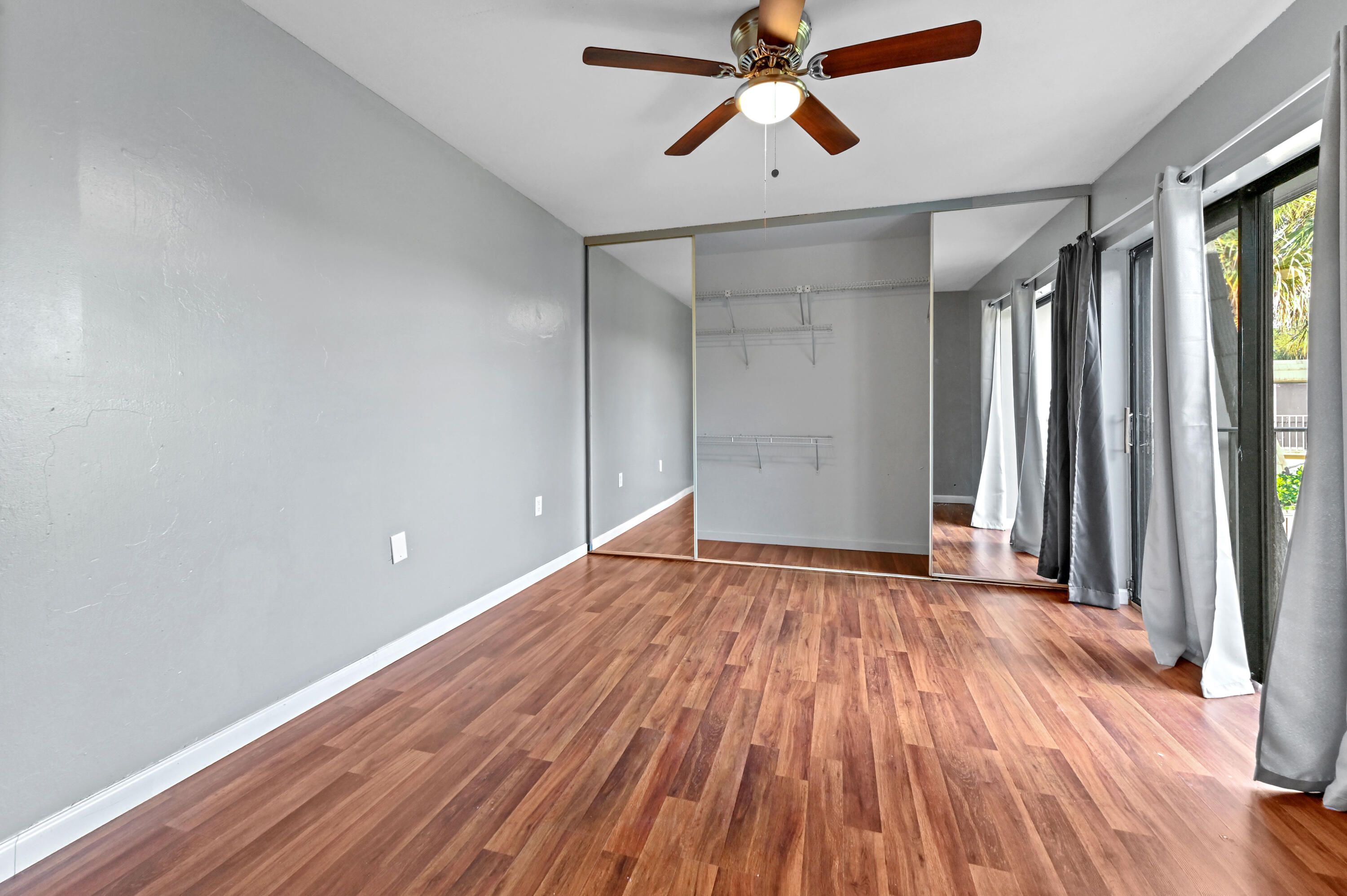 619 6th Way West Palm Beach, FL 33407 - Photo 13 of 24 wooden floor in an empty room with a window