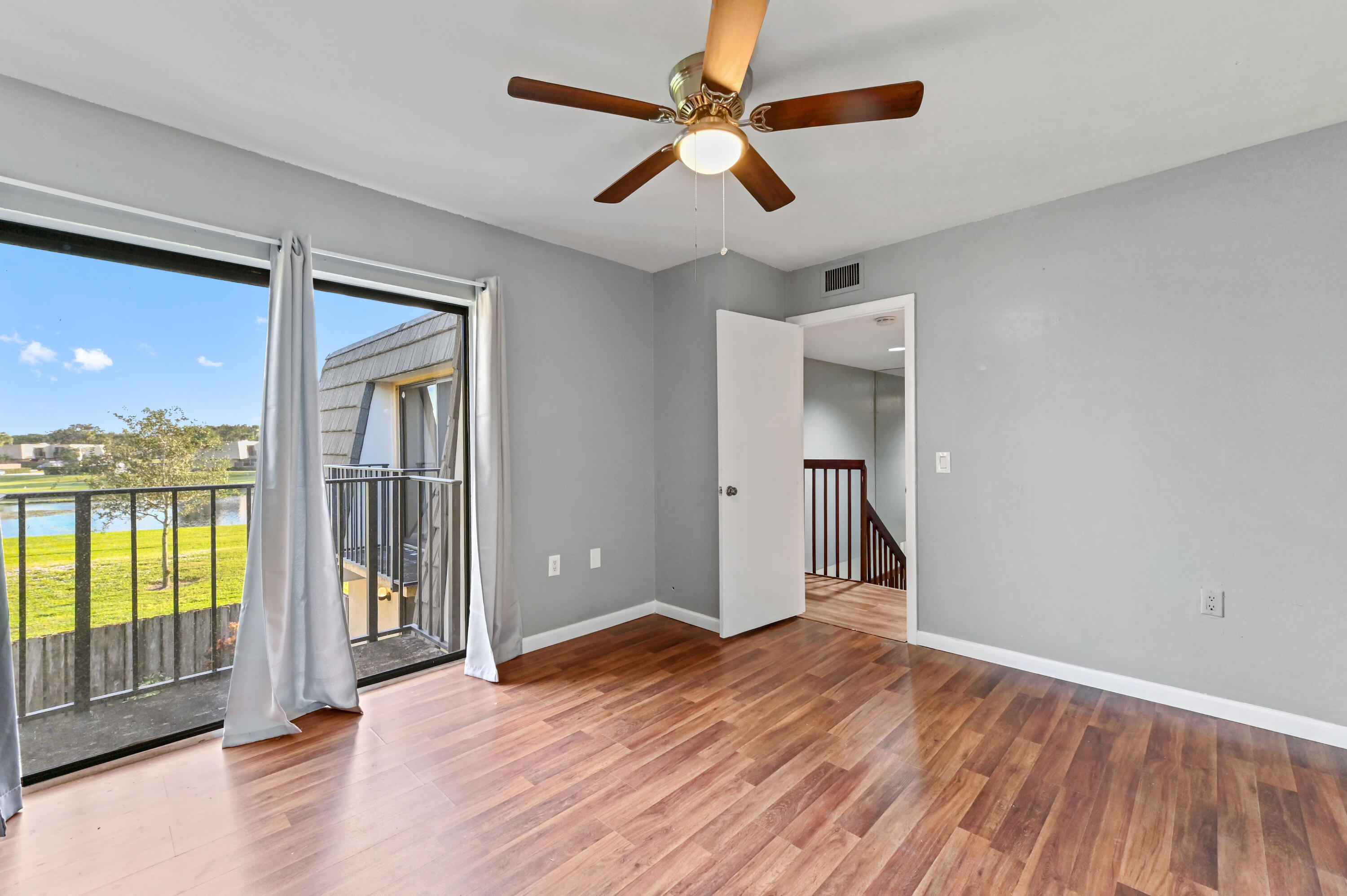 619 6th Way West Palm Beach, FL 33407 - Photo 14 of 24 wooden floor in an empty room with a window