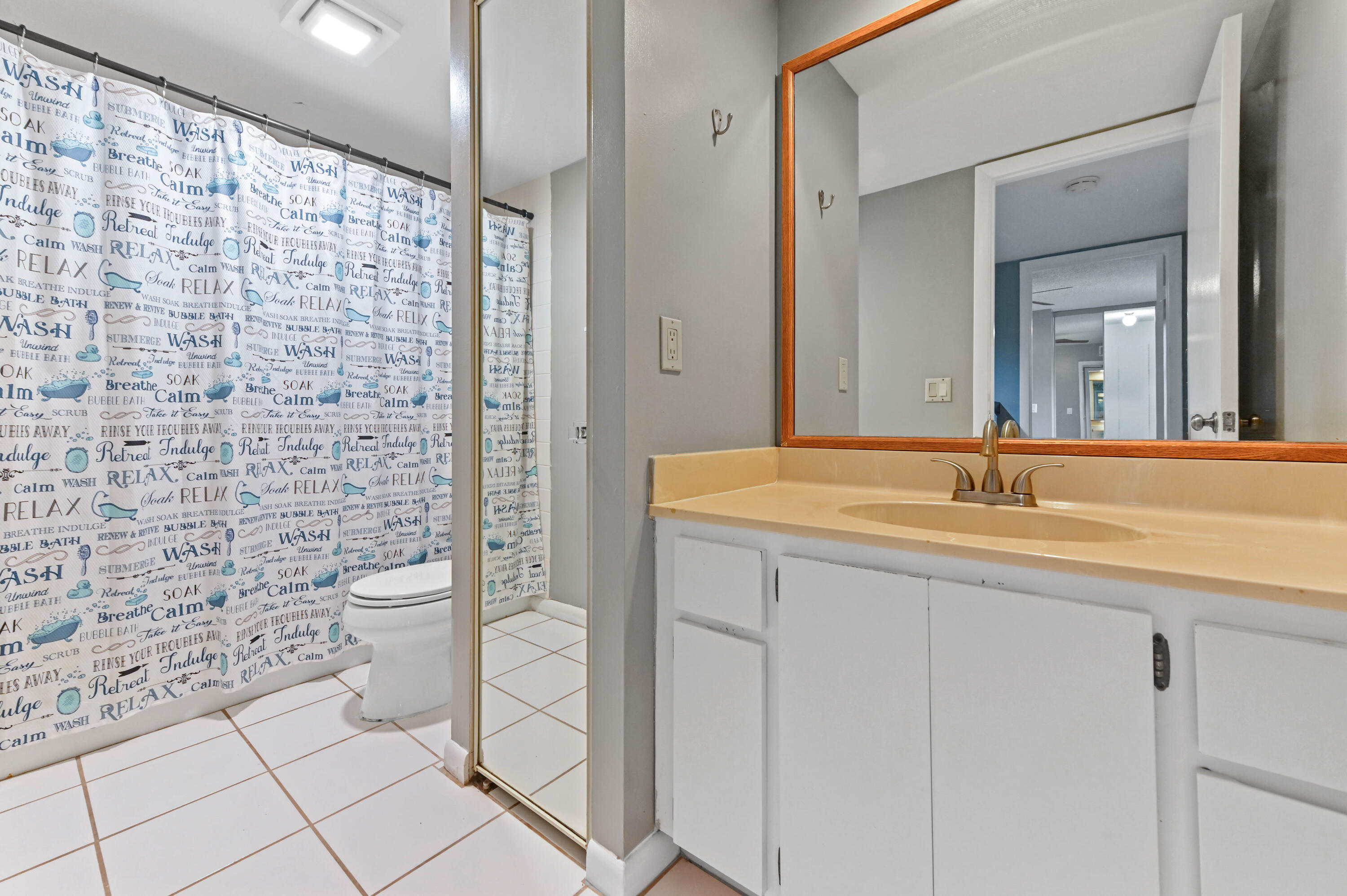 619 6th Way West Palm Beach, FL 33407 - Photo 15 of 24 a bathroom with a sink a toilet and shower