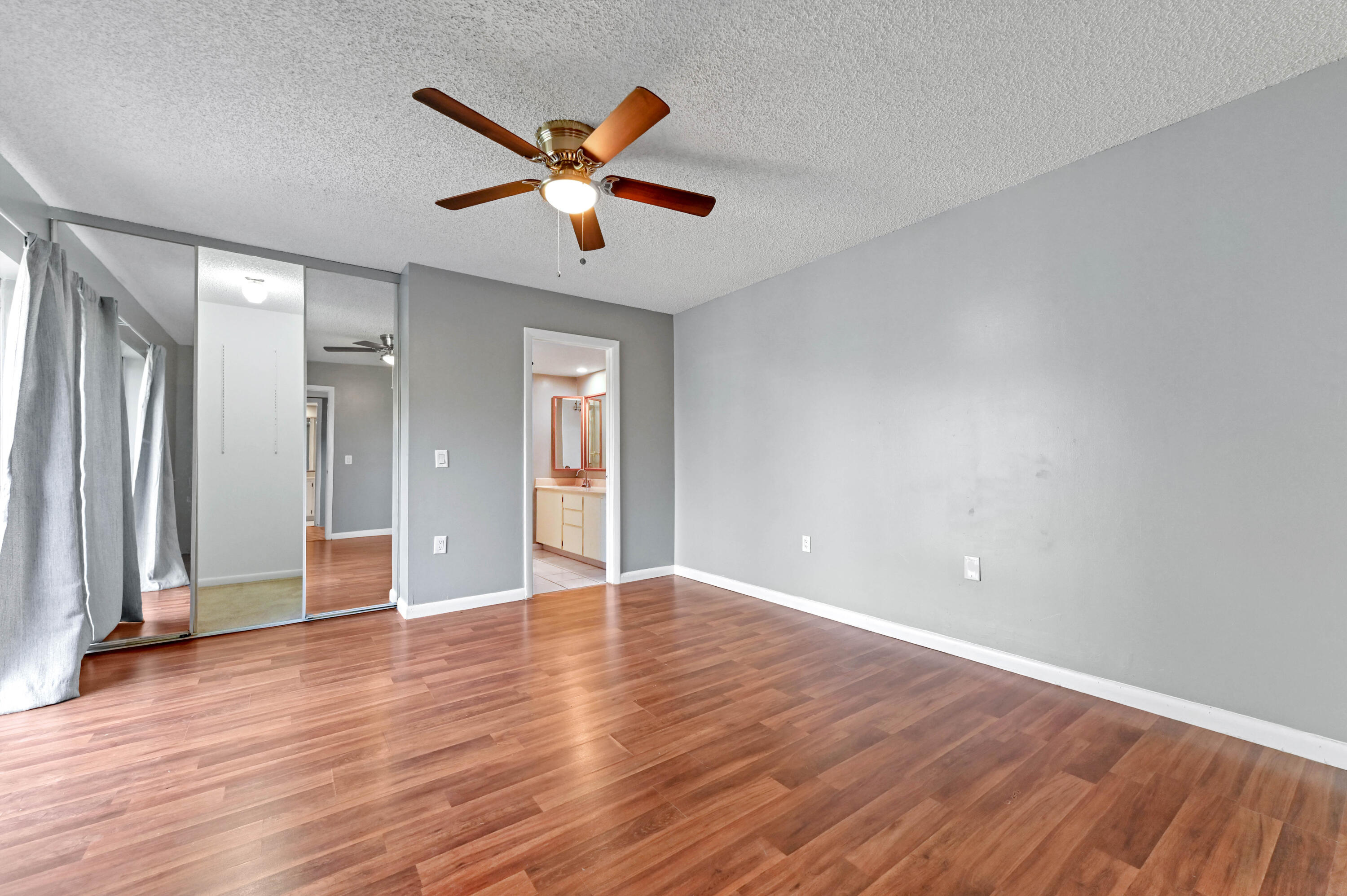 619 6th Way West Palm Beach, FL 33407 - Photo 16 of 24 wooden floor in an empty room with a window