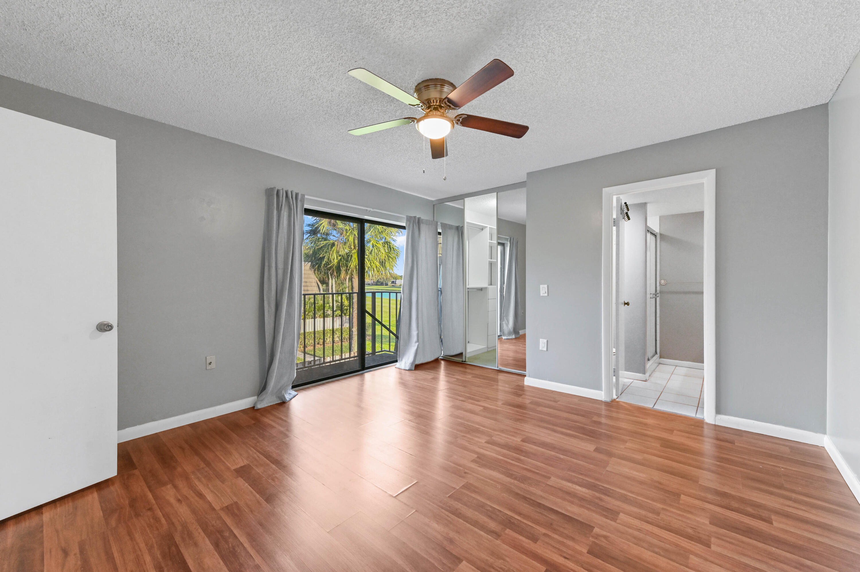 619 6th Way West Palm Beach, FL 33407 - Photo 17 of 24 a view of an empty room with wooden floor and a window