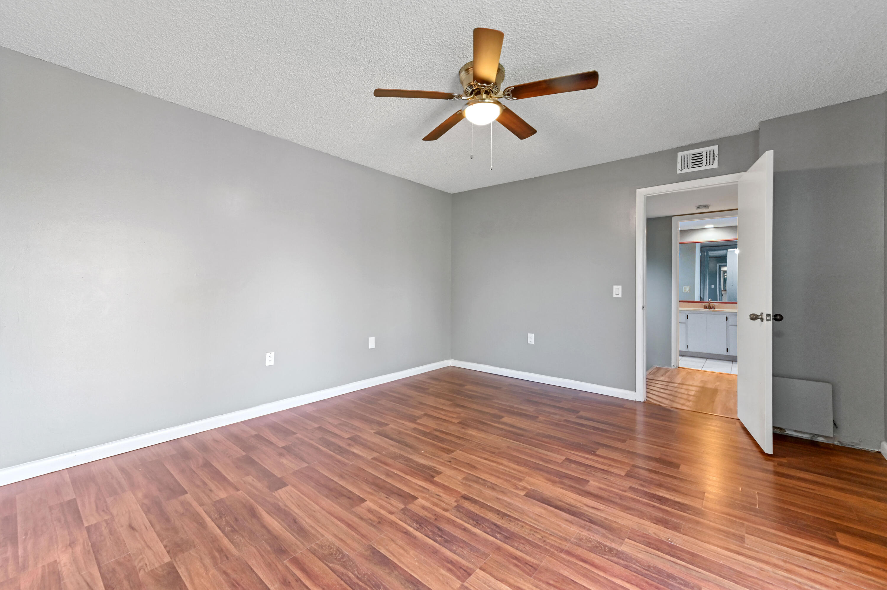 619 6th Way West Palm Beach, FL 33407 - Photo 19 of 24 wooden floor in an empty room with a window