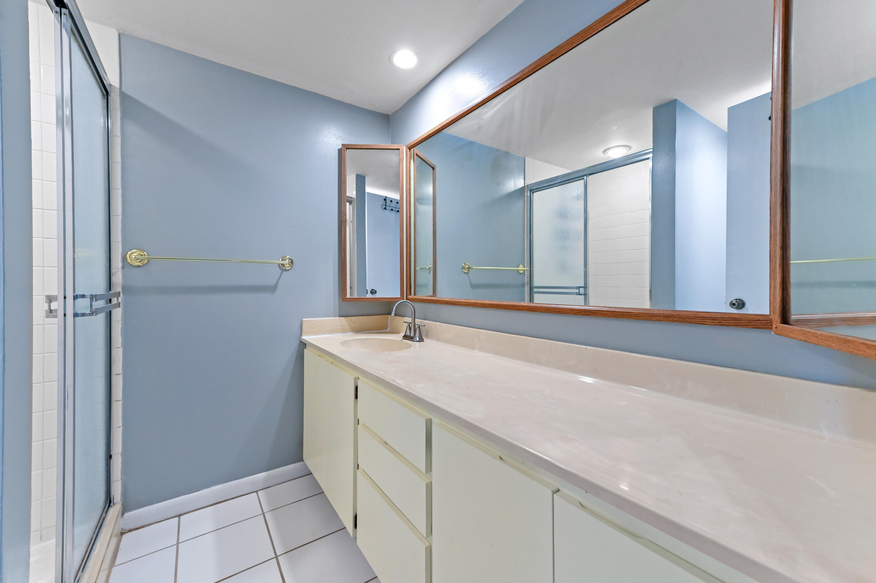 619 6th Way West Palm Beach, FL 33407 - Photo 20 of 24 a bathroom with a double vanity sink and a mirror