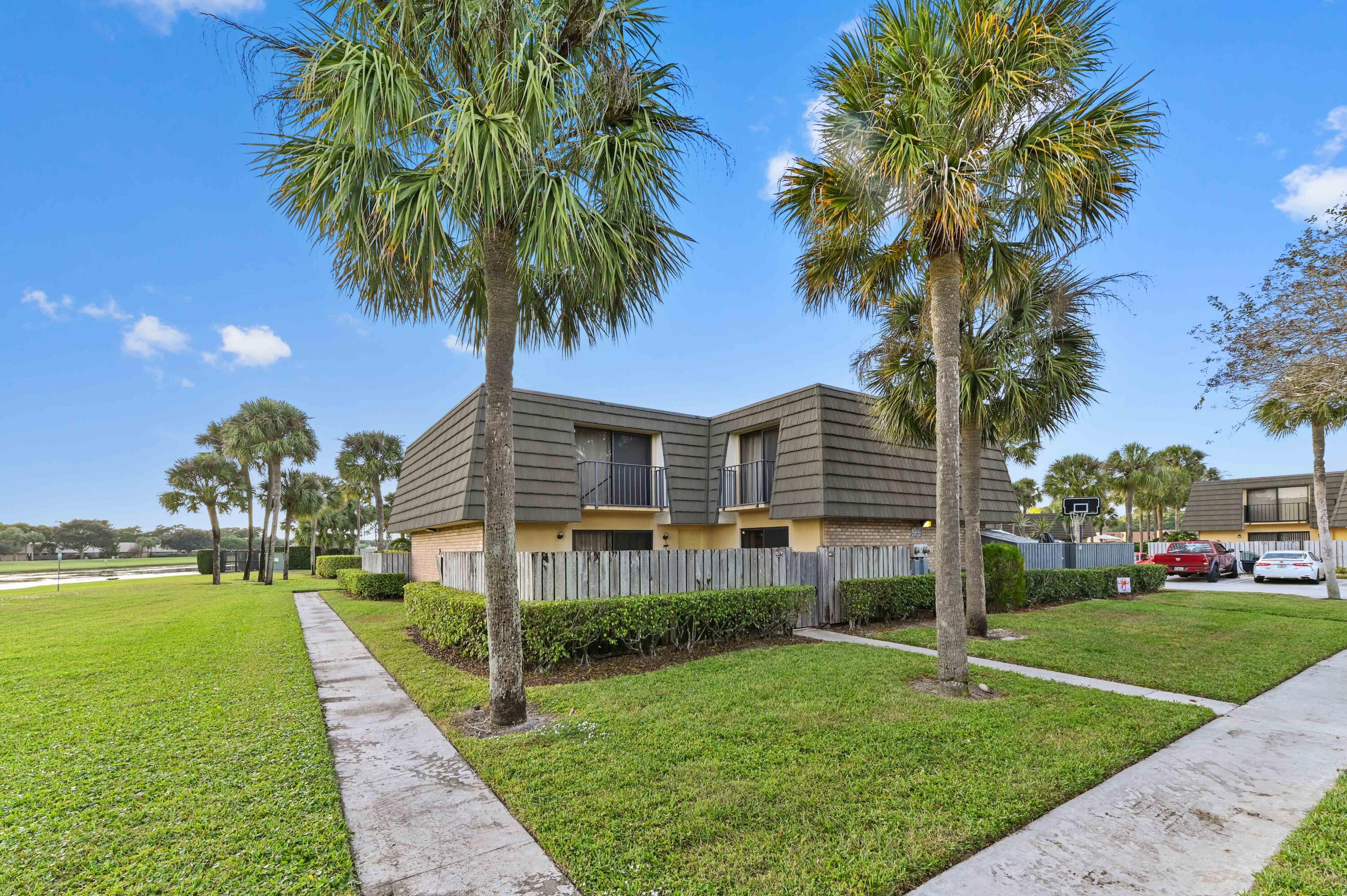 619 6th Way West Palm Beach, FL 33407 - Photo 2 of 24 a front view of house with yard and green space