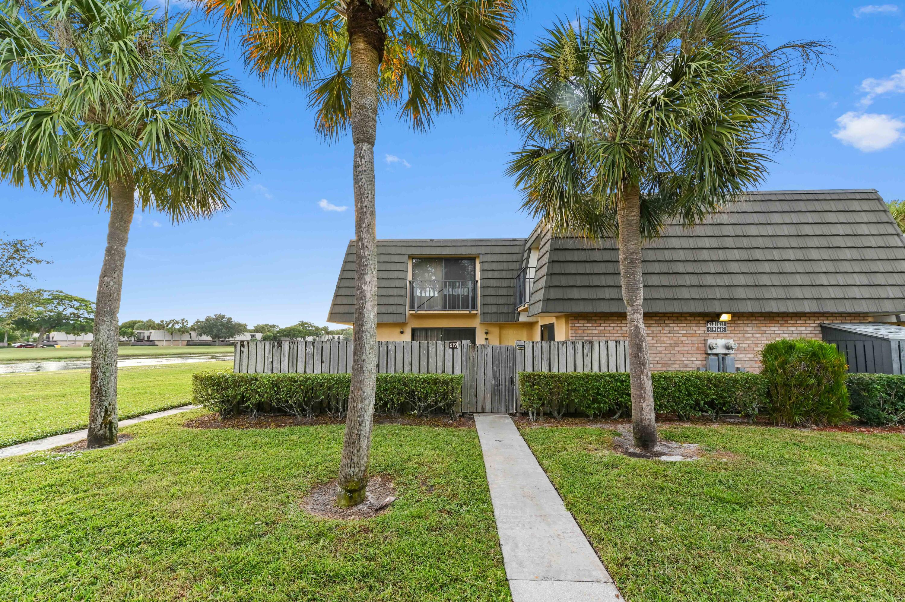 619 6th Way West Palm Beach, FL 33407 - Photo 22 of 24 a view of a backyard with a garden