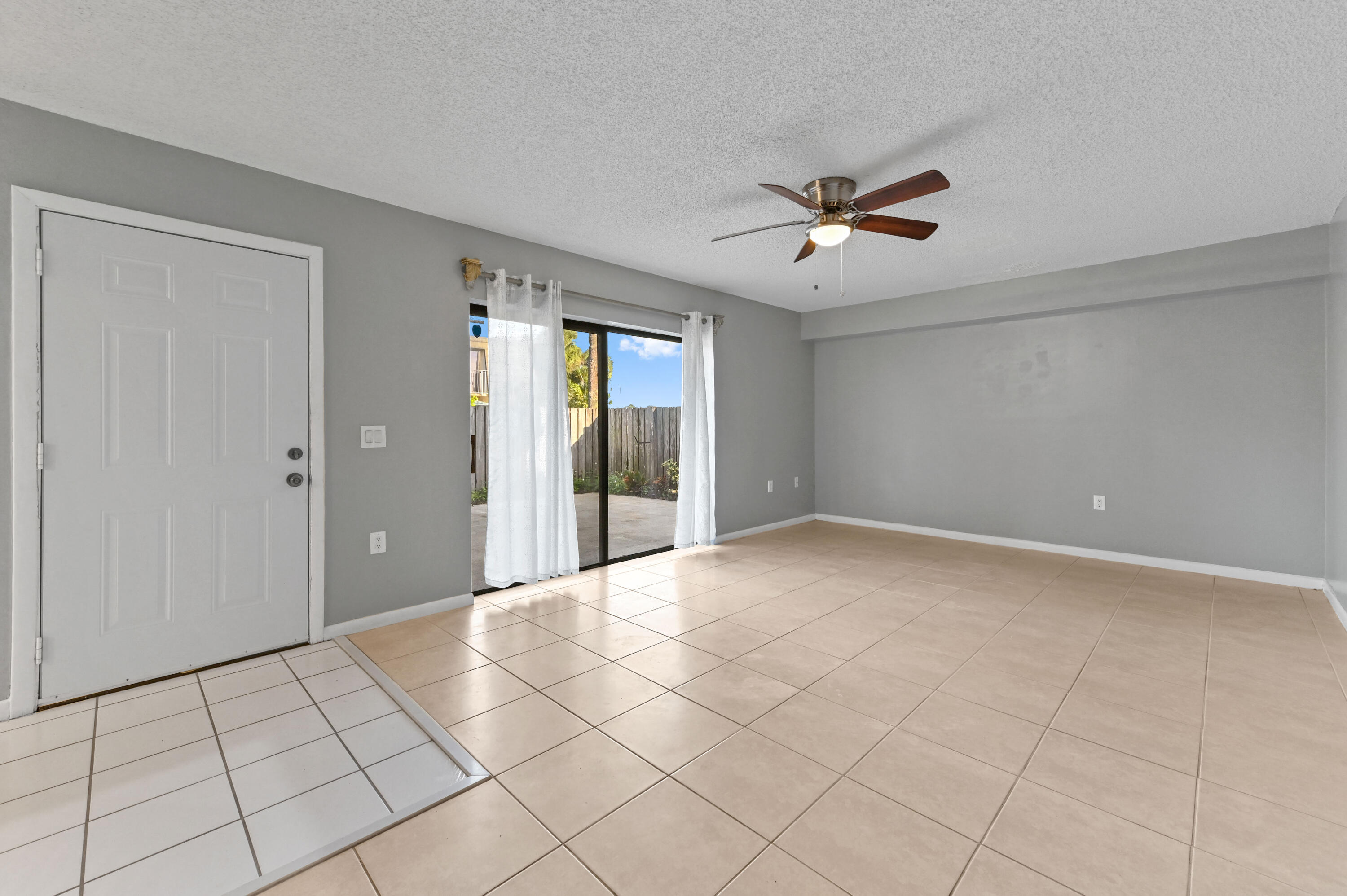 619 6th Way West Palm Beach, FL 33407 - Photo 6 of 24 a view of an empty room and chandelier fan