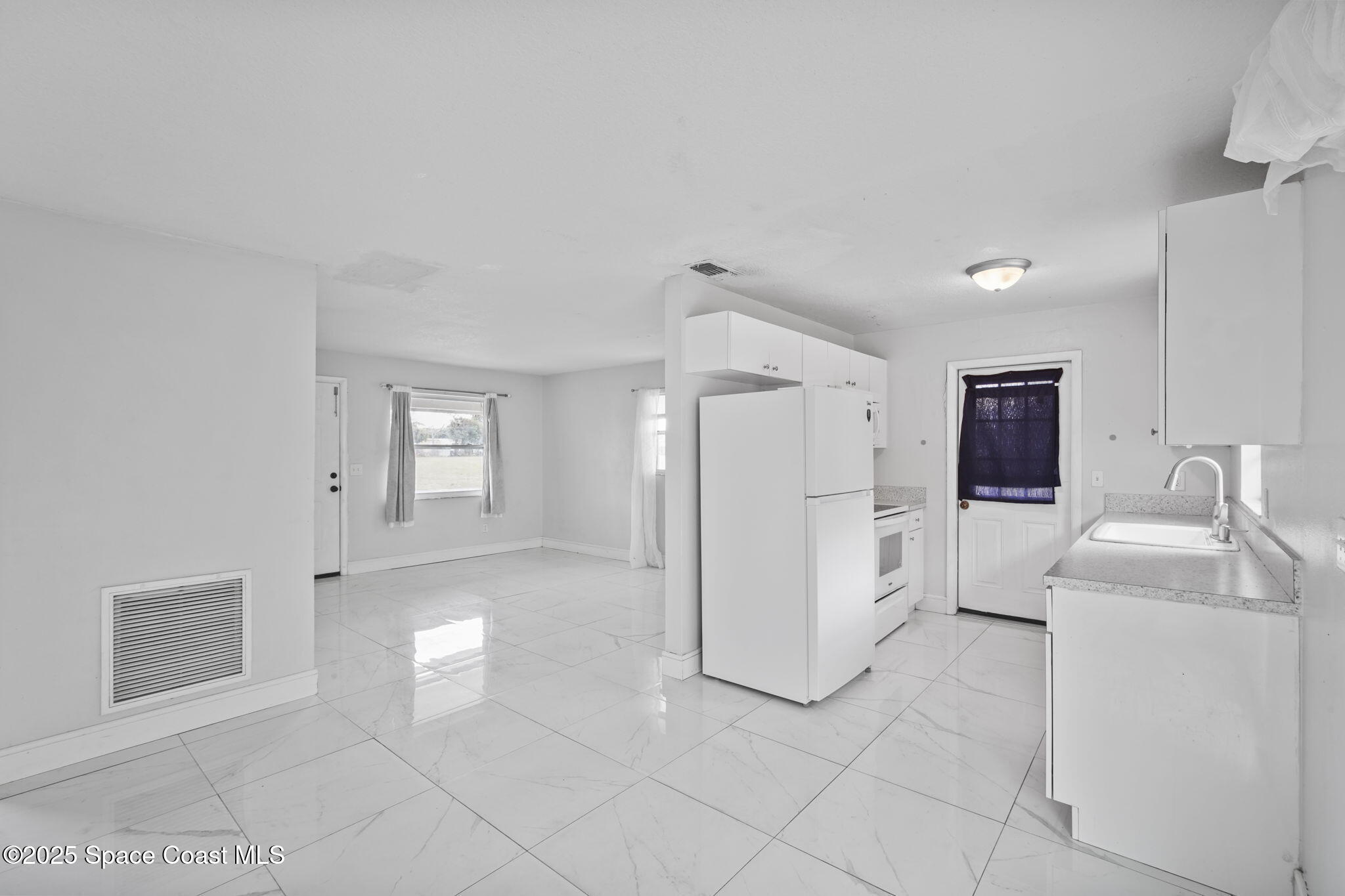 93 Prospect Avenue Cocoa, FL 32922 - Photo 14 of 25 a view of a storage & utility room with closet washer and dryer