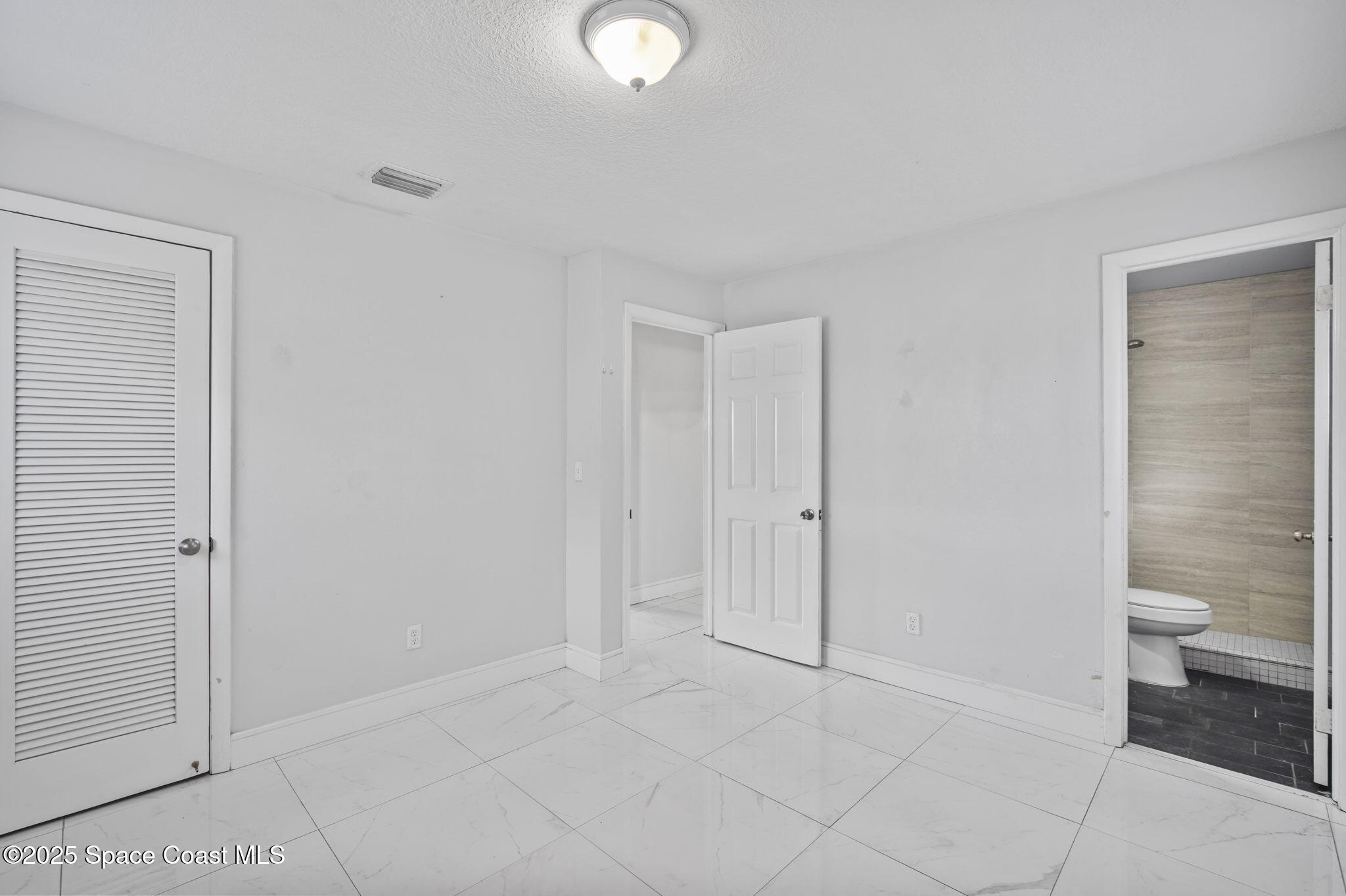 93 Prospect Avenue Cocoa, FL 32922 - Photo 15 of 25 a view of a bathroom with a toilet