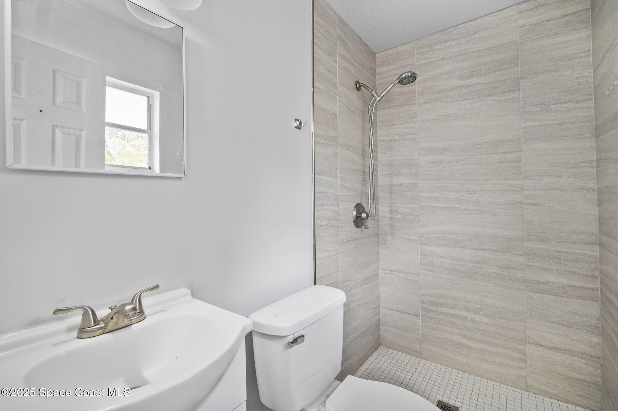 93 Prospect Avenue Cocoa, FL 32922 - Photo 17 of 25 a bathroom with a sink toilet and shower
