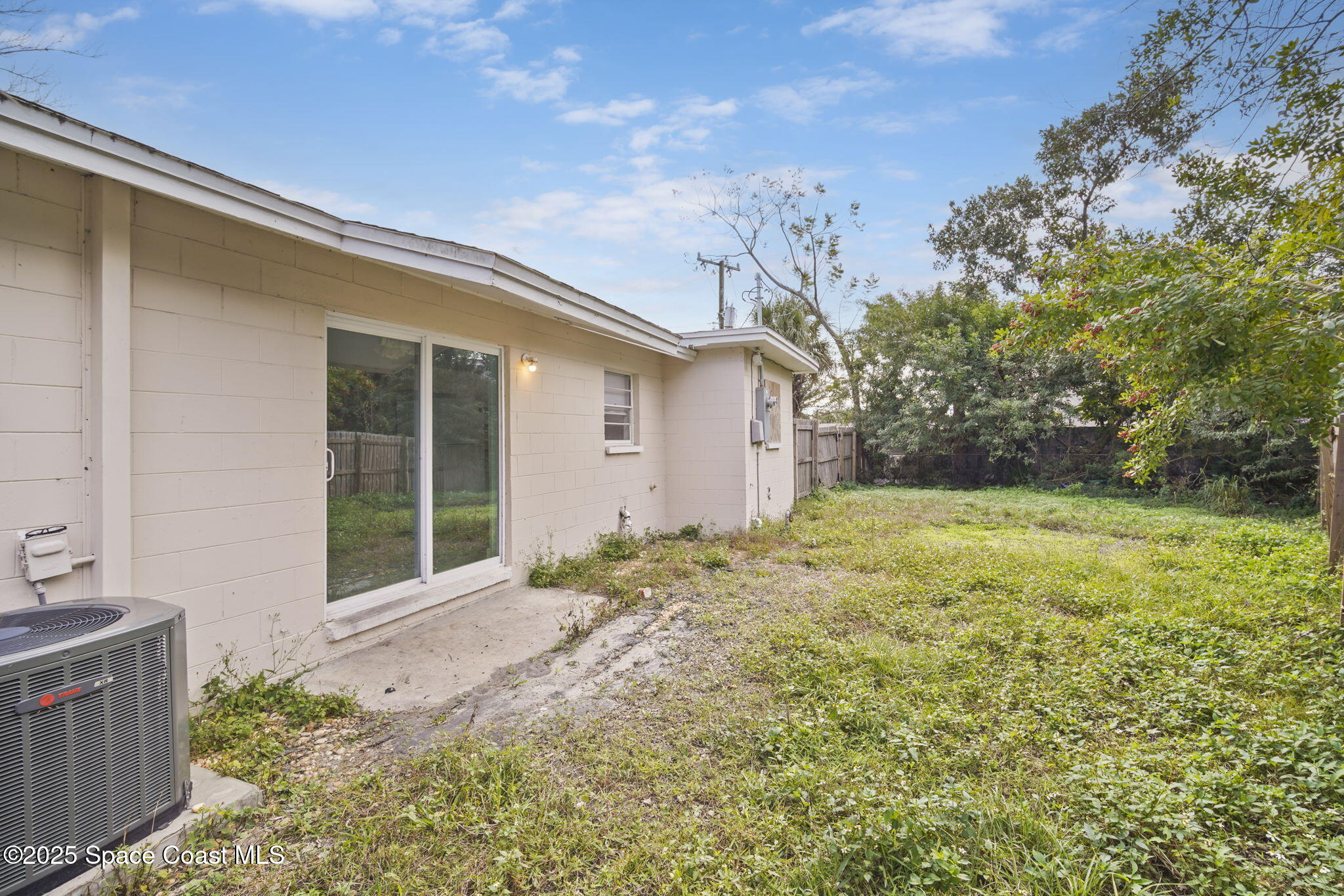 93 Prospect Avenue Cocoa, FL 32922 - Photo 24 of 25 a view of a backyard with plants and large tree