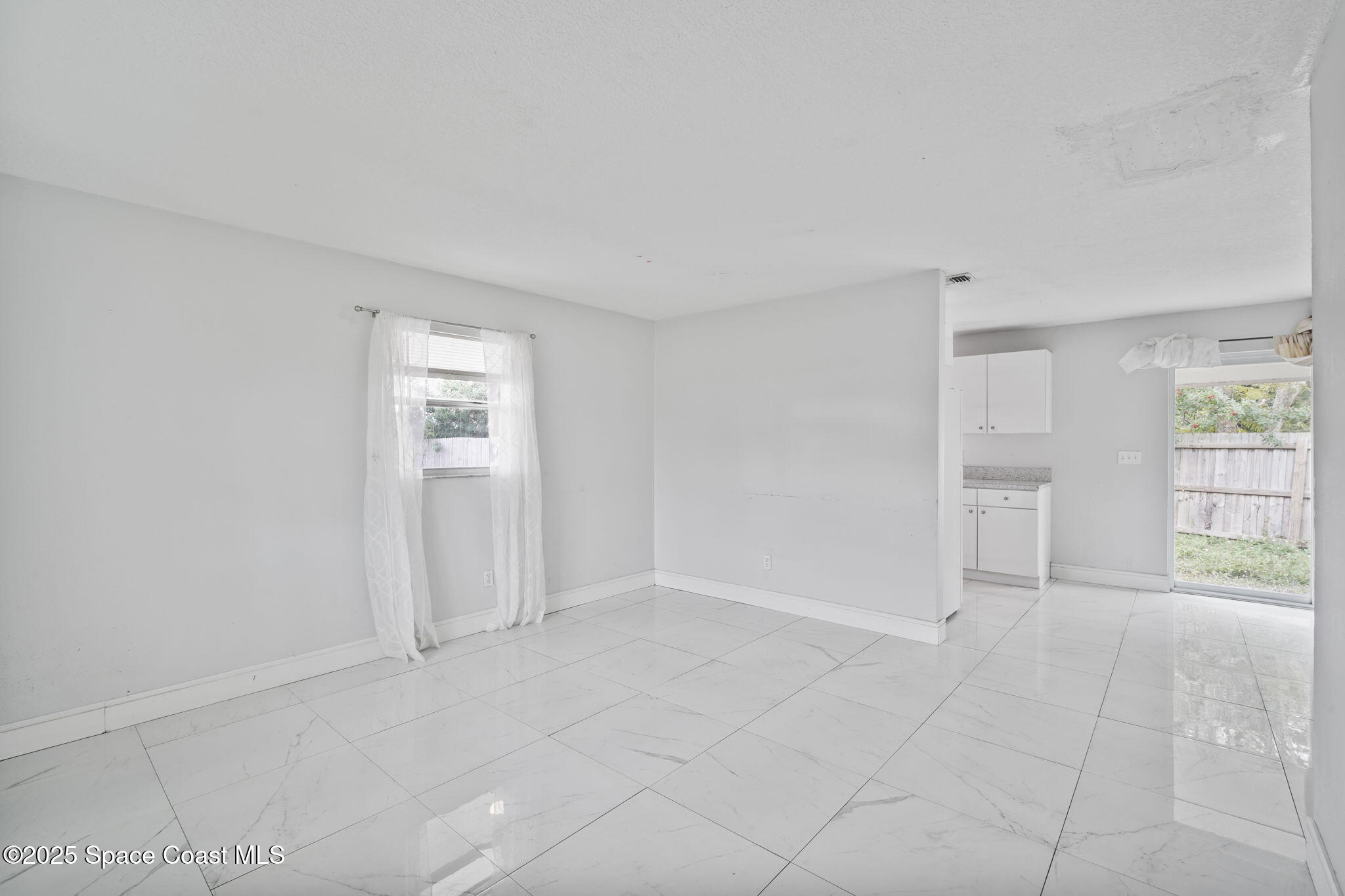 93 Prospect Avenue Cocoa, FL 32922 - Photo 6 of 25 an empty room with windows and closet