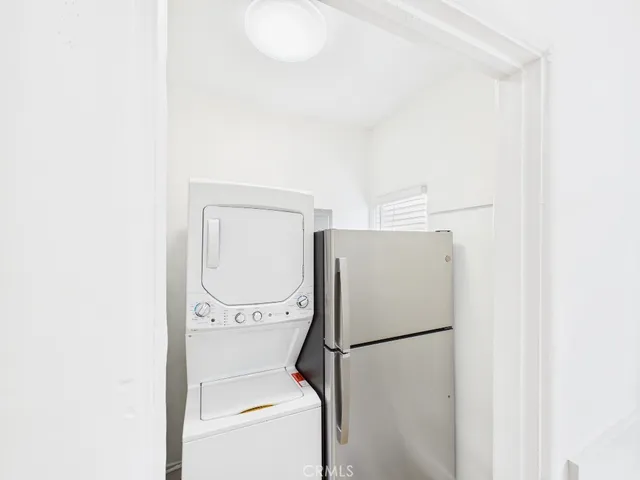 a white refrigerator freezer and a dishwasher sitting in a kitchen