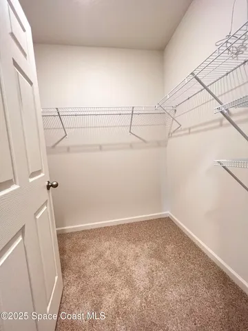 a bathroom with a granite countertop sink a mirror and a vanity