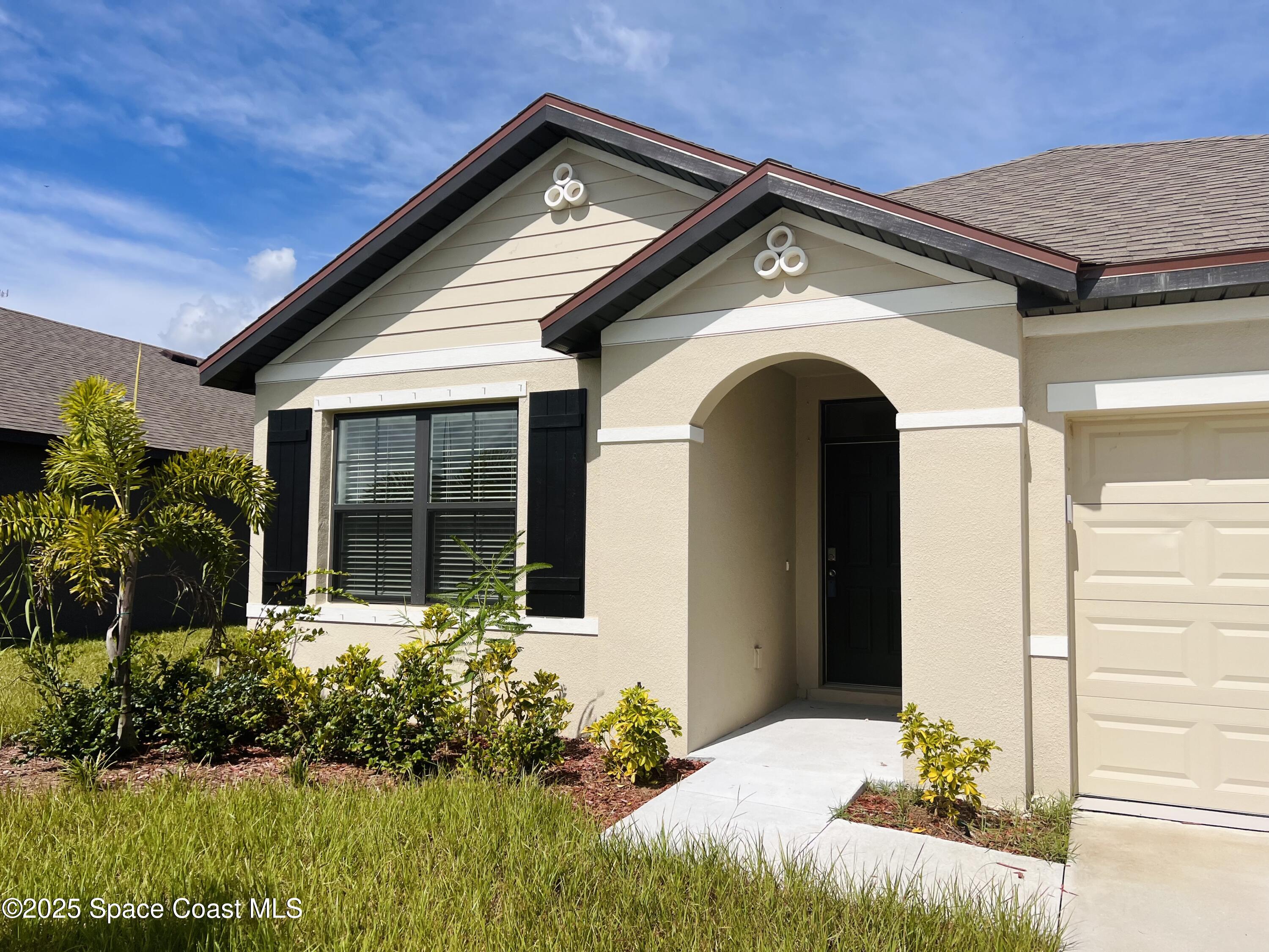 4631 Talbot Boulevard Cocoa, FL 32926 - Photo 2 of 24 a front view of a house with a yard