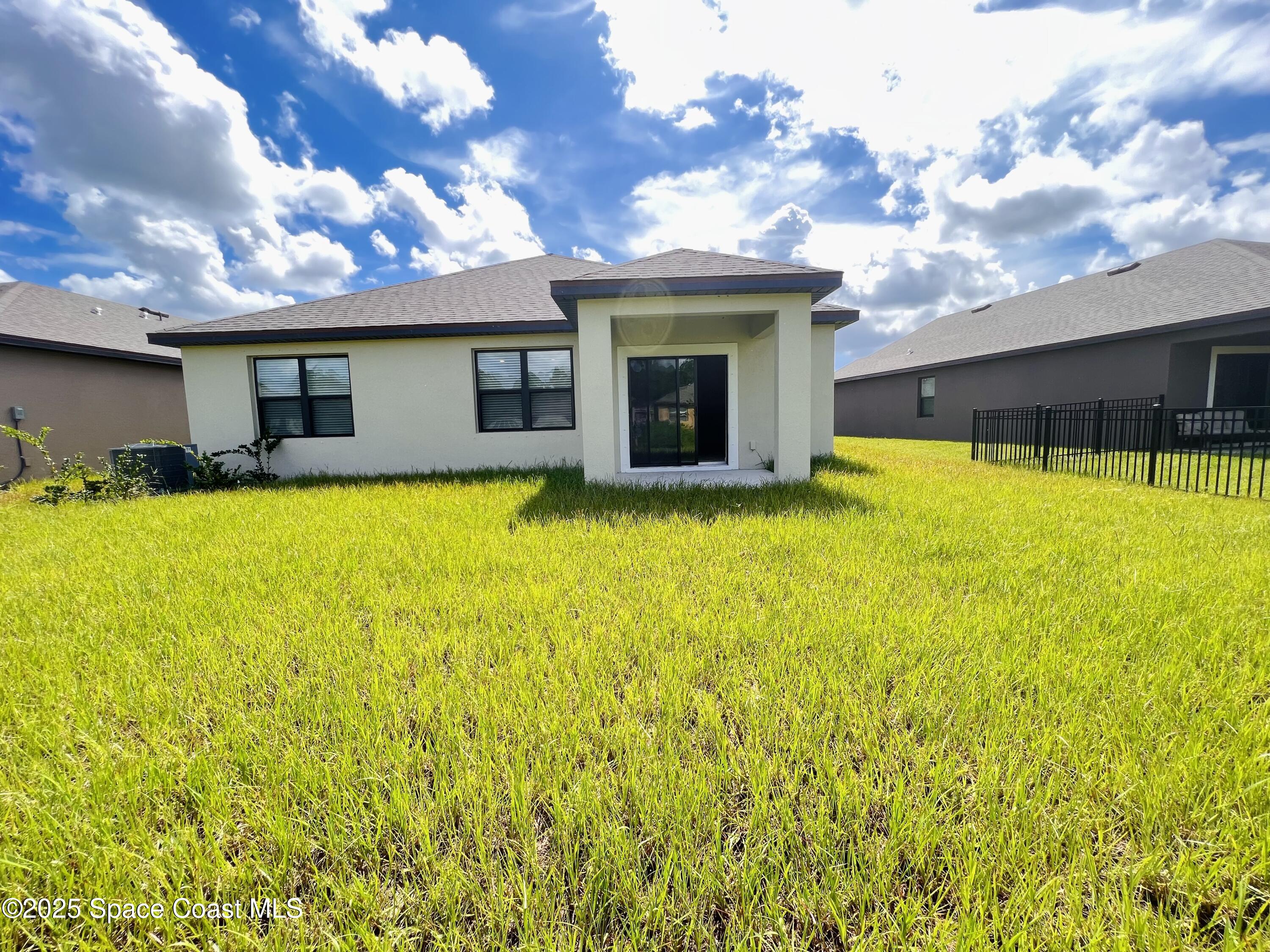 4631 Talbot Boulevard Cocoa, FL 32926 - Photo 24 of 24 a view of a house with pool and a yard