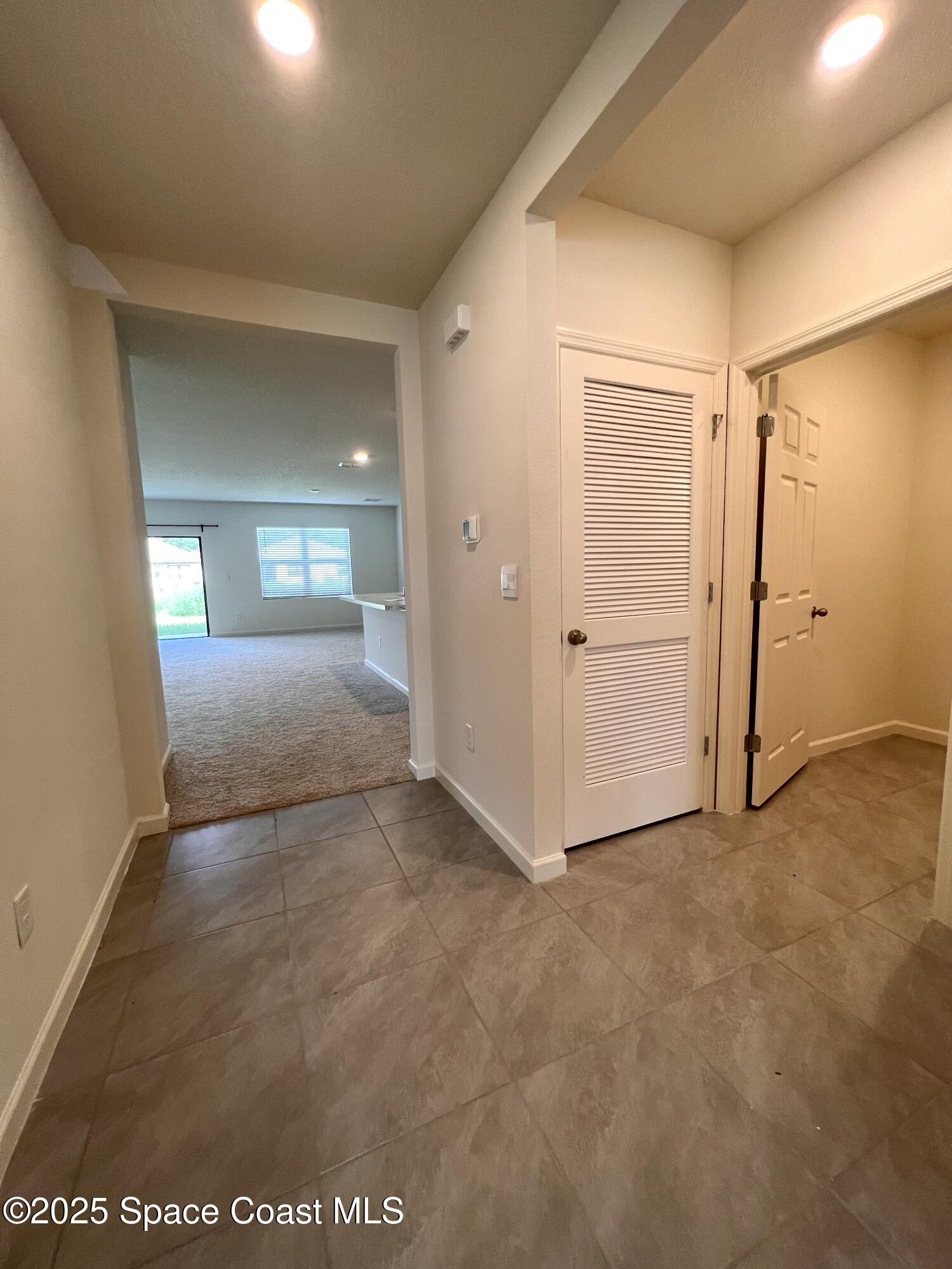 4631 Talbot Boulevard Cocoa, FL 32926 - Photo 4 of 24 an empty room with windows and closet