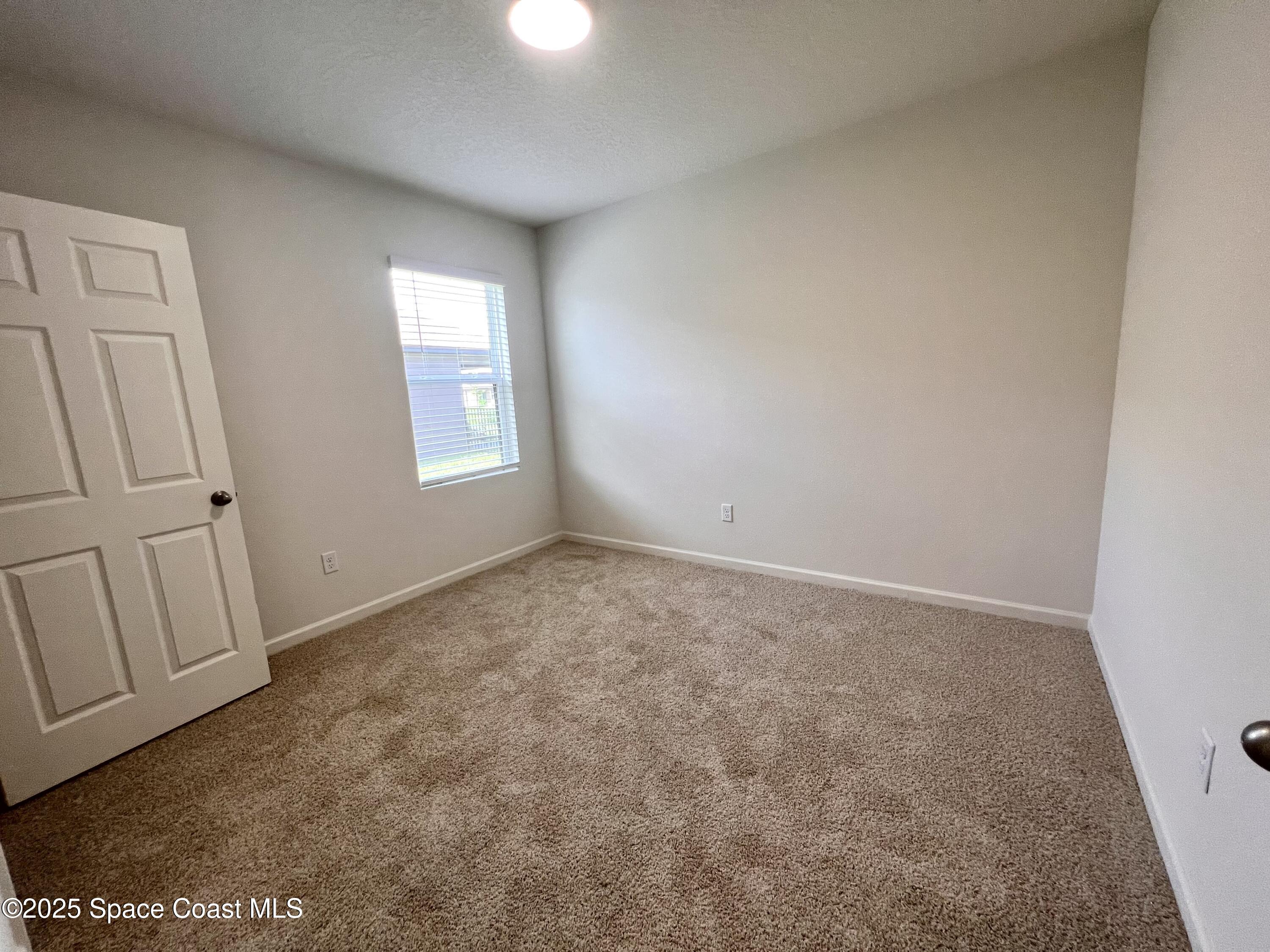 4631 Talbot Boulevard Cocoa, FL 32926 - Photo 7 of 24 an empty room with windows