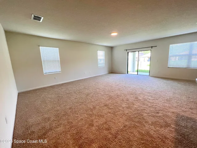 a view of kitchen and kitchen with furniture wooden floor and window