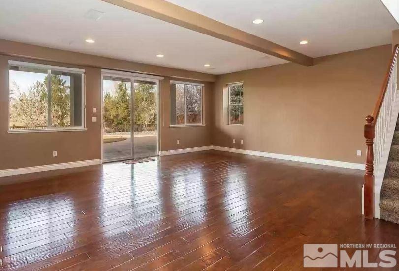 2820 Oxley Drive Sparks, NV 89436 - Photo 9 of 10 a view of an empty room with wooden floor and a window