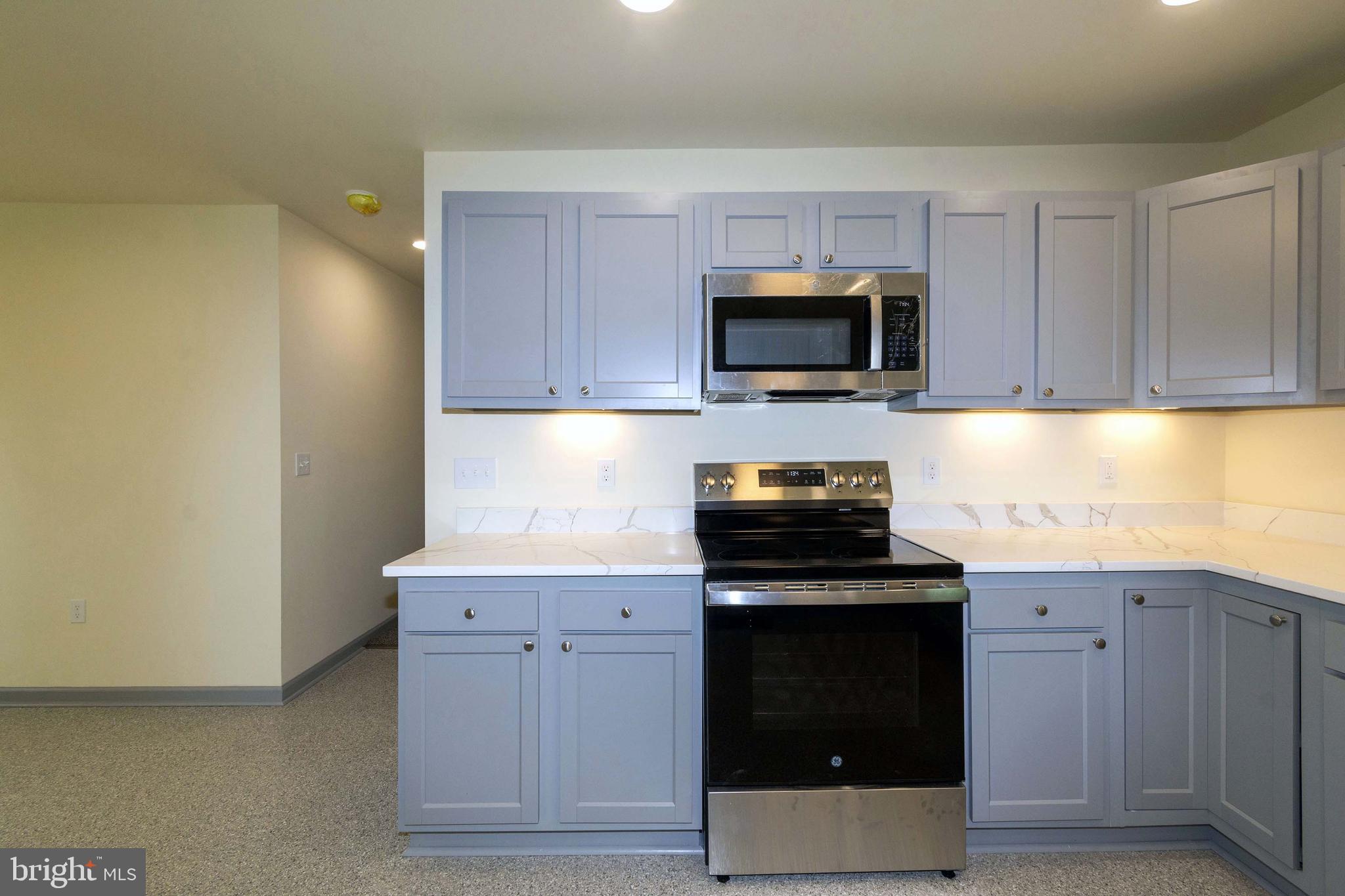 20738 Monrovia Road Orange, VA 22960 - Photo 21 of 50 a kitchen with a sink and a stove top oven