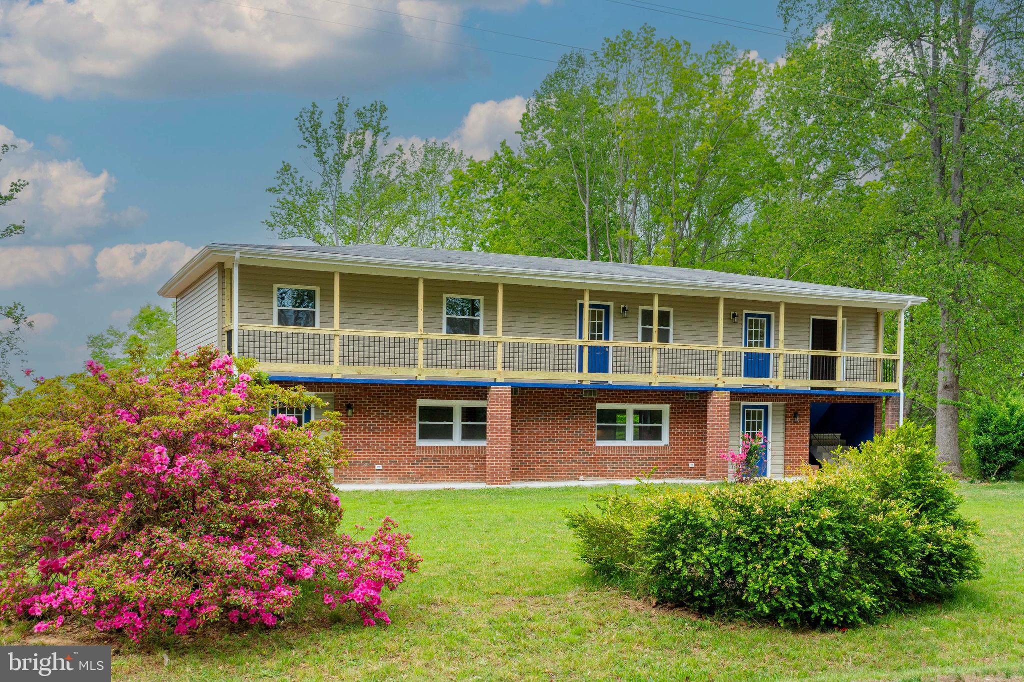 20738 Monrovia Road Orange, VA 22960 - Photo 3 of 50 a view of a house with a yard and garden