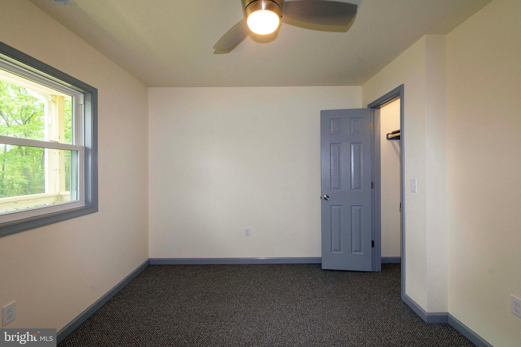 20738 Monrovia Road Orange, VA 22960 - Photo 35 of 50 an empty room with window and wooden floor