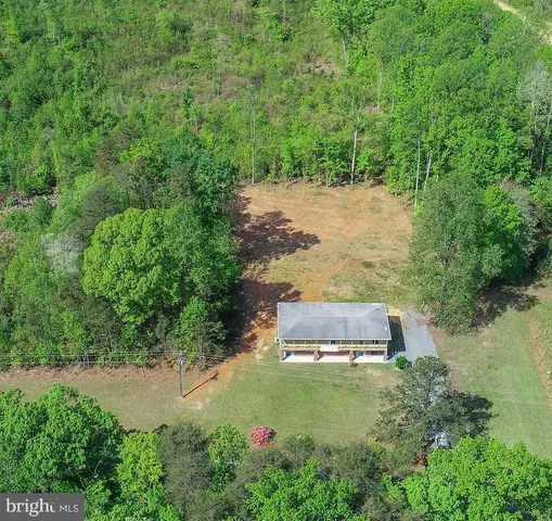 a aerial view of a house with a yard