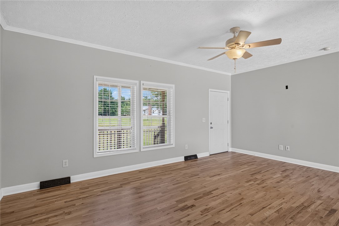 564 Fairfield Road Walhalla, SC 29691 - Photo 8 of 50 Rich wood floors and clean crown molding establish a refined foundation in this inviting space.