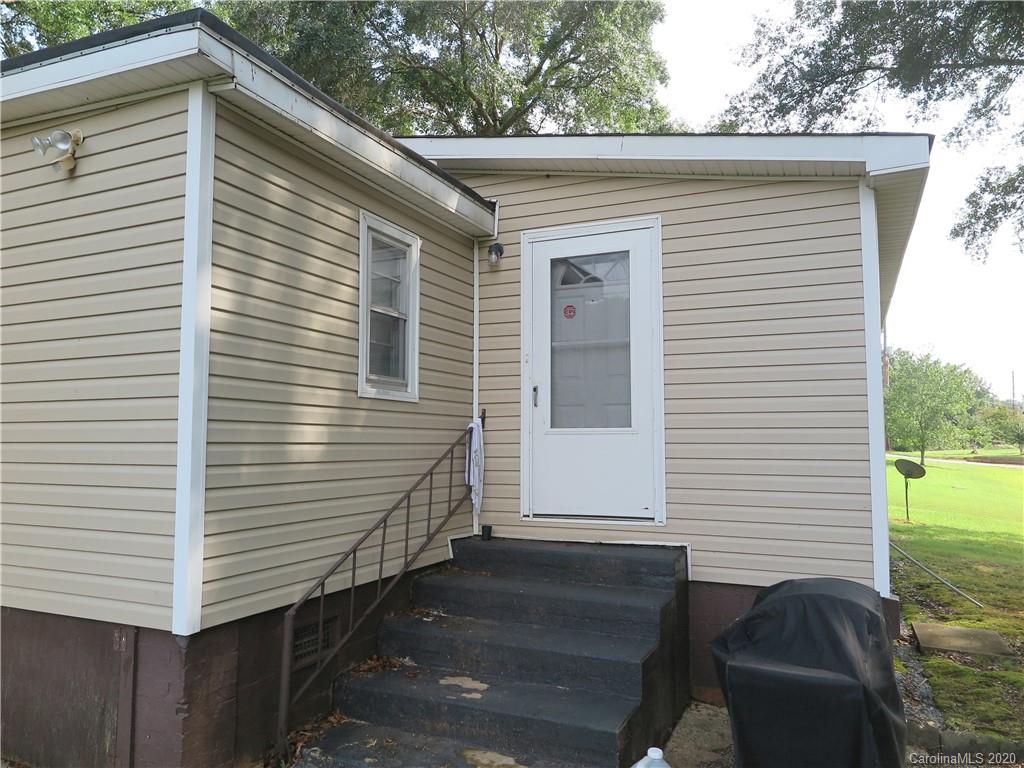 515 Upper Spencer Mountain Road Stanley, NC 28164 - Photo 11 of 28 a view of house with backyard space and deck