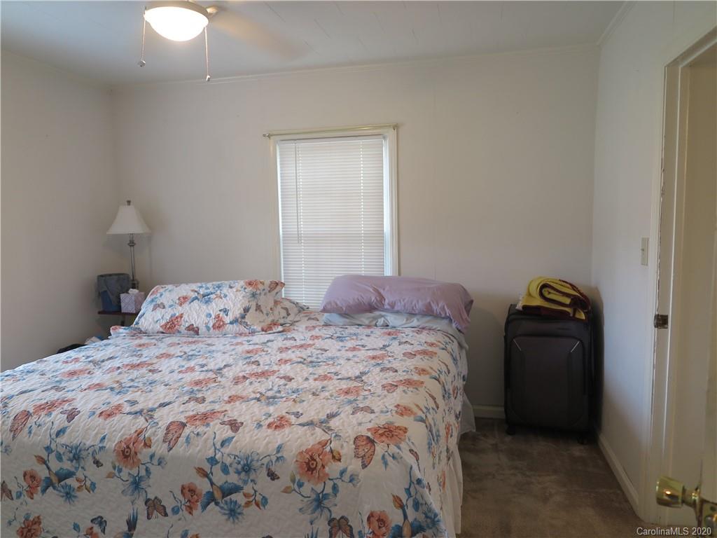 515 Upper Spencer Mountain Road Stanley, NC 28164 - Photo 12 of 28 a bedroom with a bed and window