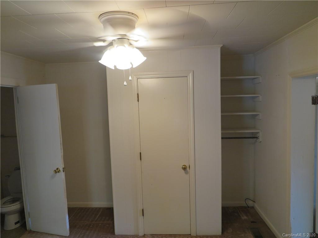 515 Upper Spencer Mountain Road Stanley, NC 28164 - Photo 16 of 28 a bathroom with a chandelier fan and a window