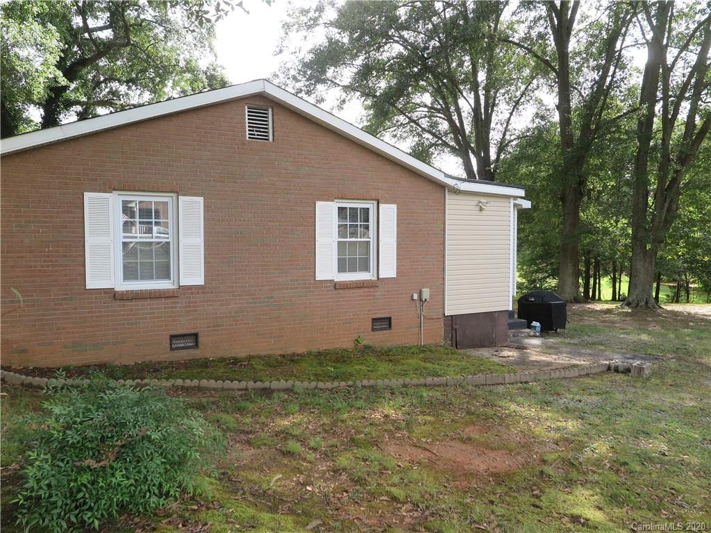 515 Upper Spencer Mountain Road Stanley, NC 28164 - Photo 3 of 28 a backyard of a house with lots of green space