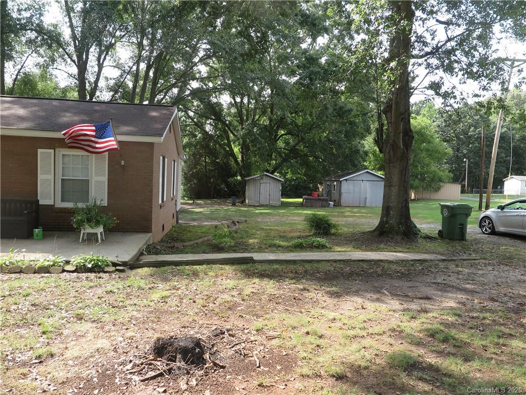 515 Upper Spencer Mountain Road Stanley, NC 28164 - Photo 24 of 28 a view of backyard with large trees