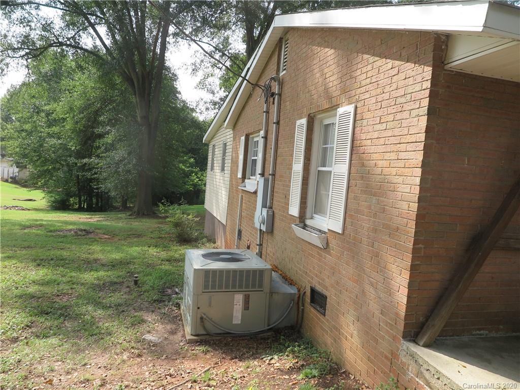 515 Upper Spencer Mountain Road Stanley, NC 28164 - Photo 27 of 28 a front view of a house with garden