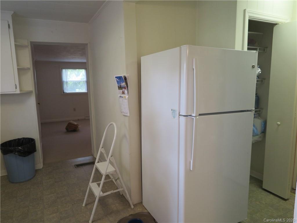 515 Upper Spencer Mountain Road Stanley, NC 28164 - Photo 6 of 28 a white refrigerator freezer sitting in a kitchen
